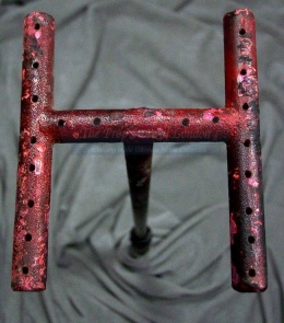 A close-up of Rimmer's branding iron. Ruined by The Prop Store's own branding, of couse. See. Clever.